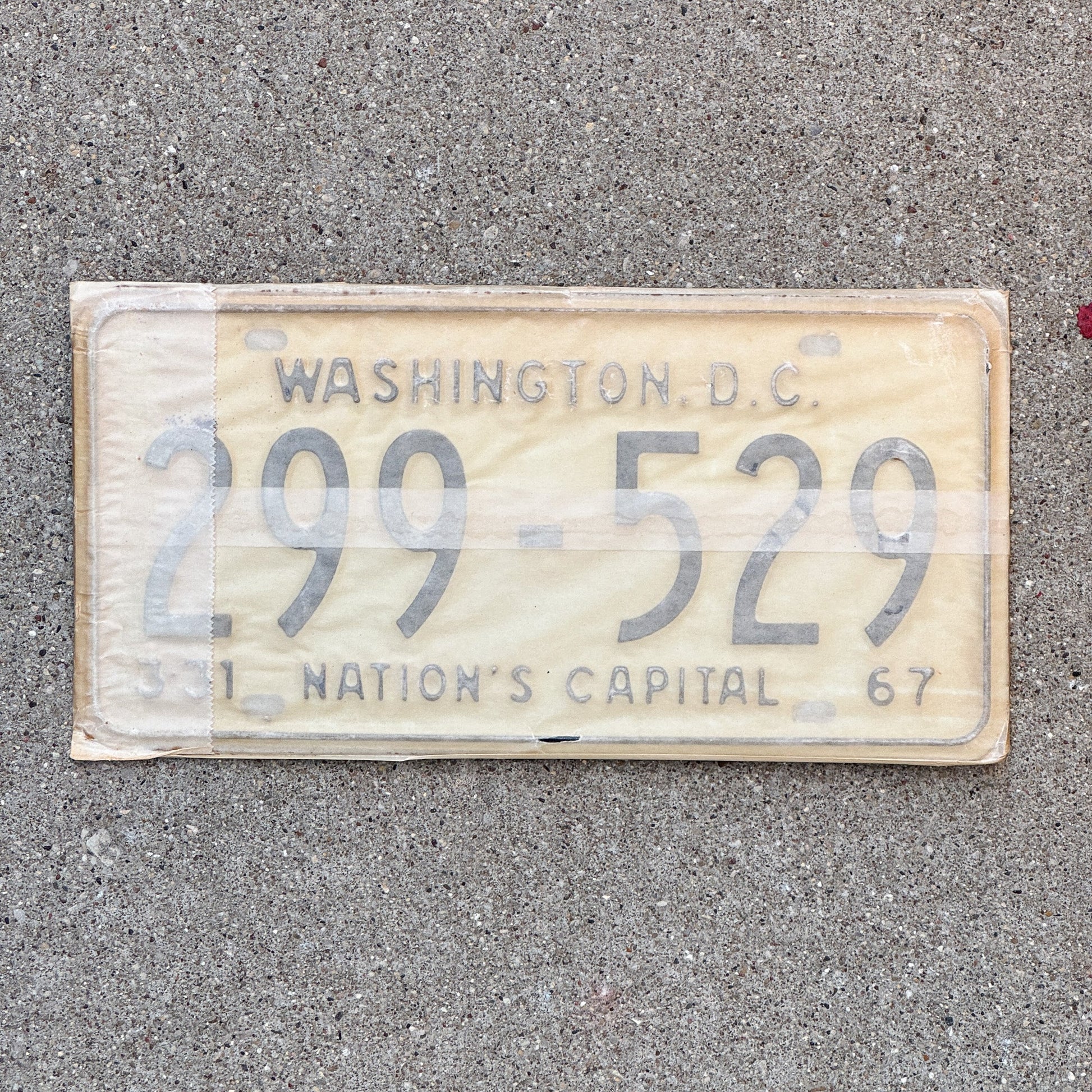 Photo of a 1967 Washington DC License Plate Pair Auto Tag Garage Decor Vintage with Envelope 299 529 with original patina