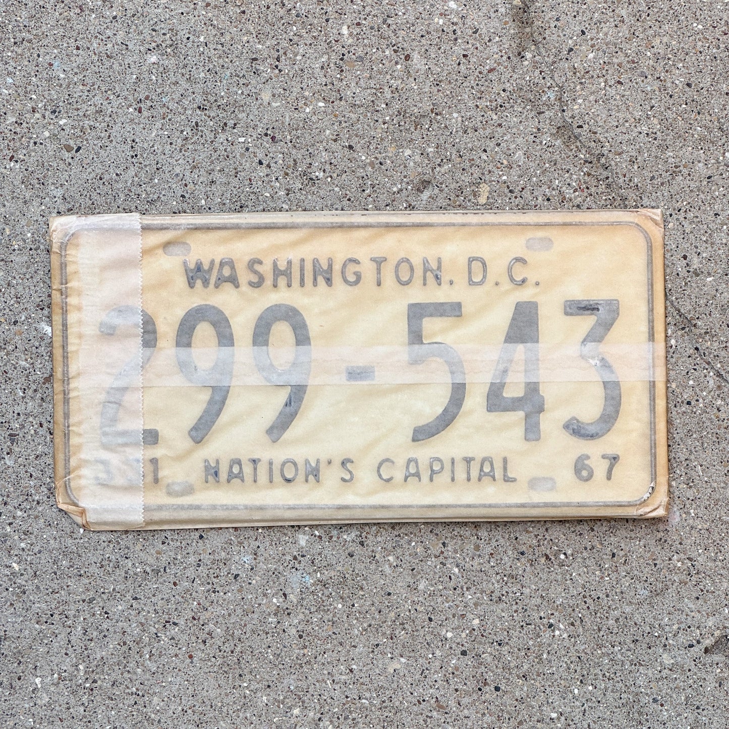 Photo of a 1967 Washington DC License Plate Pair Auto Tag Garage Decor Vintage with Envelope 299 543 with original patina