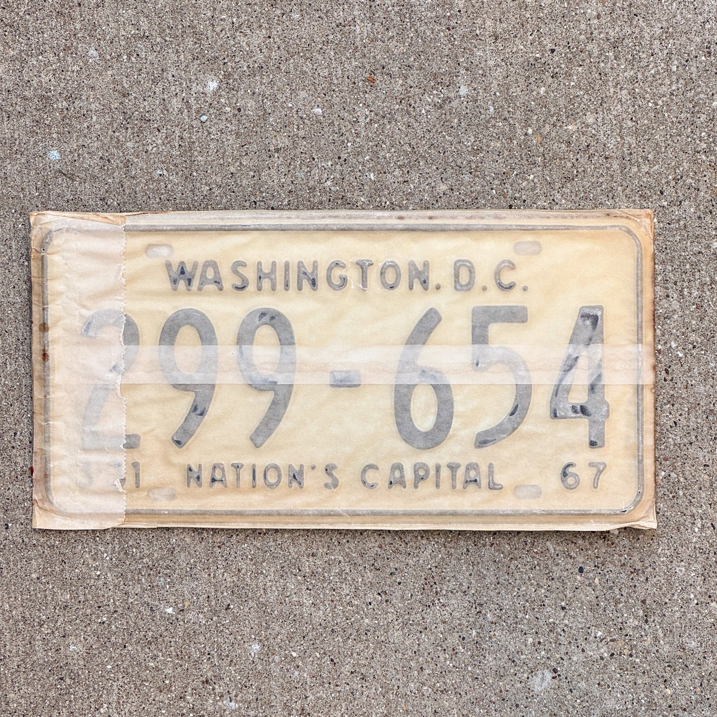 Photo of a 1967 Washington DC License Plate Pair Auto Tag Garage Decor Vintage with Envelope 299 654 with original patina