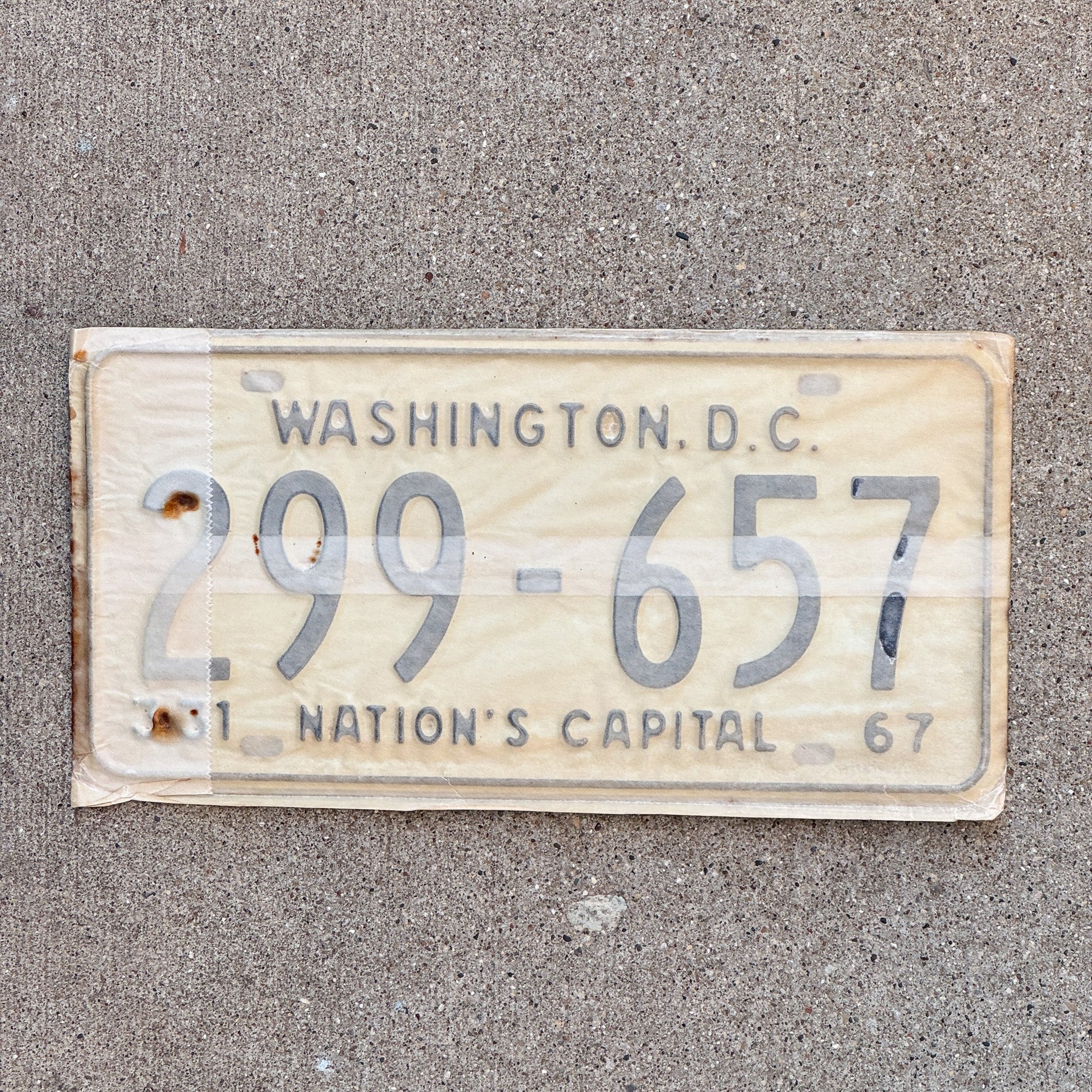 Photo of a 1967 Washington DC License Plate Pair Auto Tag Garage Decor Vintage with Envelope 299 657 with original patina