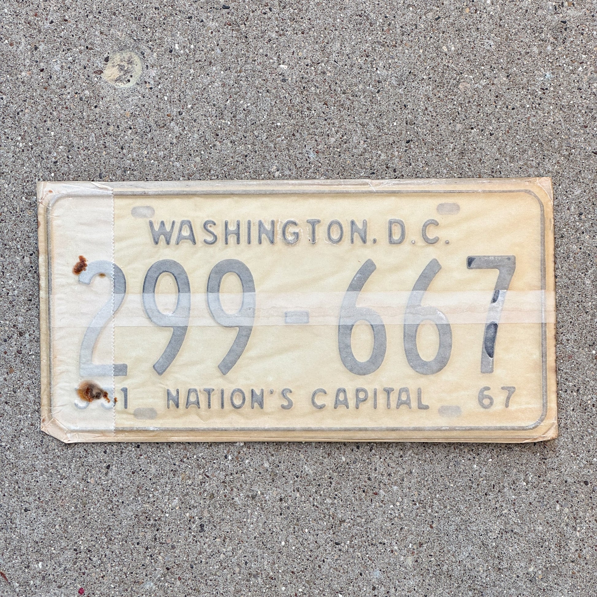Photo of a 1967 Washington DC License Plate Pair Auto Tag Garage Decor Vintage with Envelope 299 667 with original patina