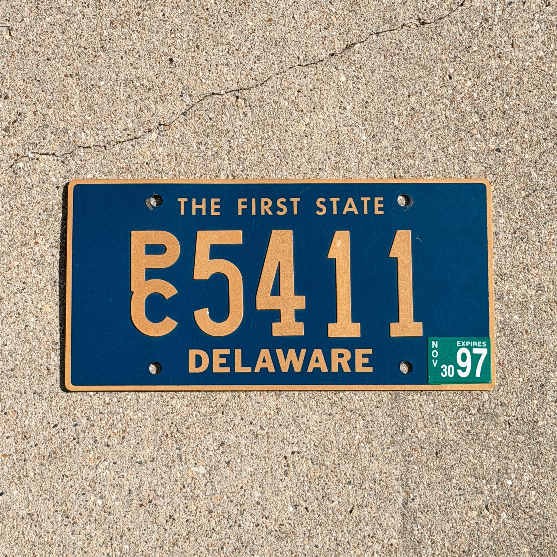Photo of a 1968 1997 Delaware Commercial License Plate Auto Tag Garage Decor Vintage PC 5411 with original patina