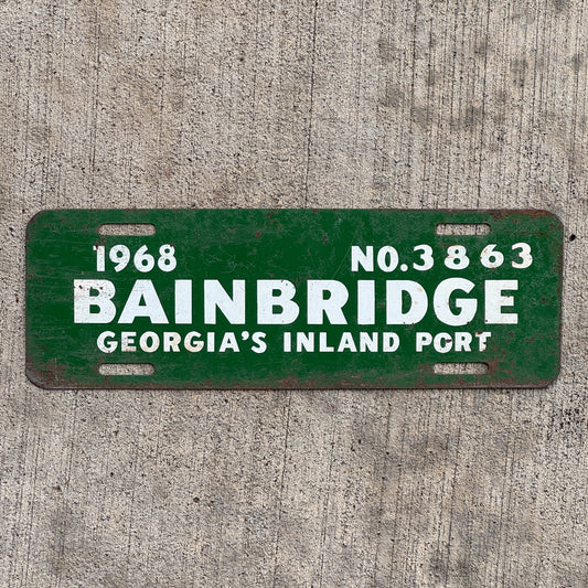 Photo of a 1968 Bainbridge Georgia License Plate Topper Auto Tag Garage Decor Vintage Inland Port 3863 with original patina