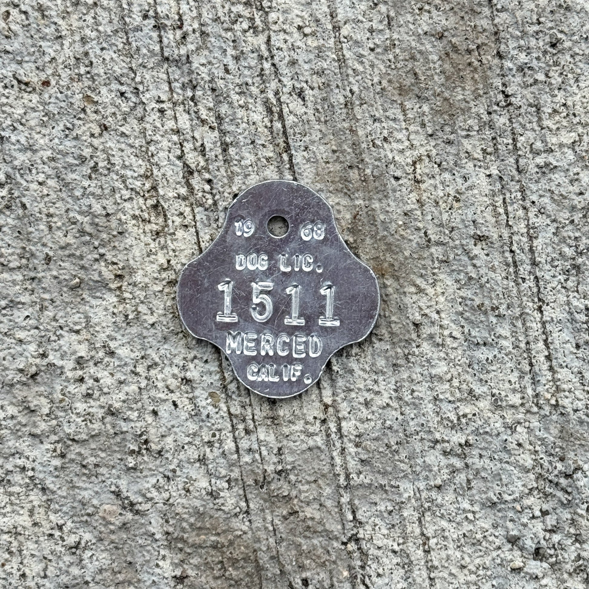 Photo of a 1968 California Dog License Auto Tag Garage Decor Vintage Merced 1511 with original patina