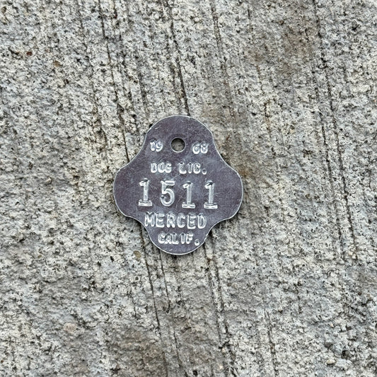Photo of a 1968 California Dog License Auto Tag Garage Decor Vintage Merced 1511 with original patina