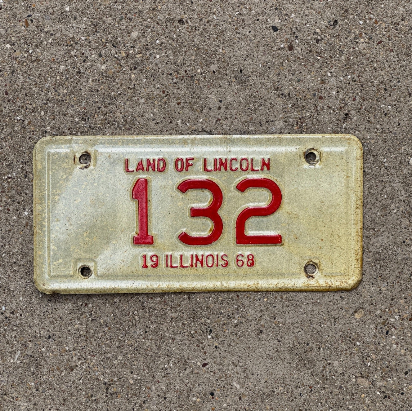 Photo of a 1968 Illinois Motorcycle License Plate Auto Tag Garage Decor Vintage Low Number Three Digit 132 with original patina