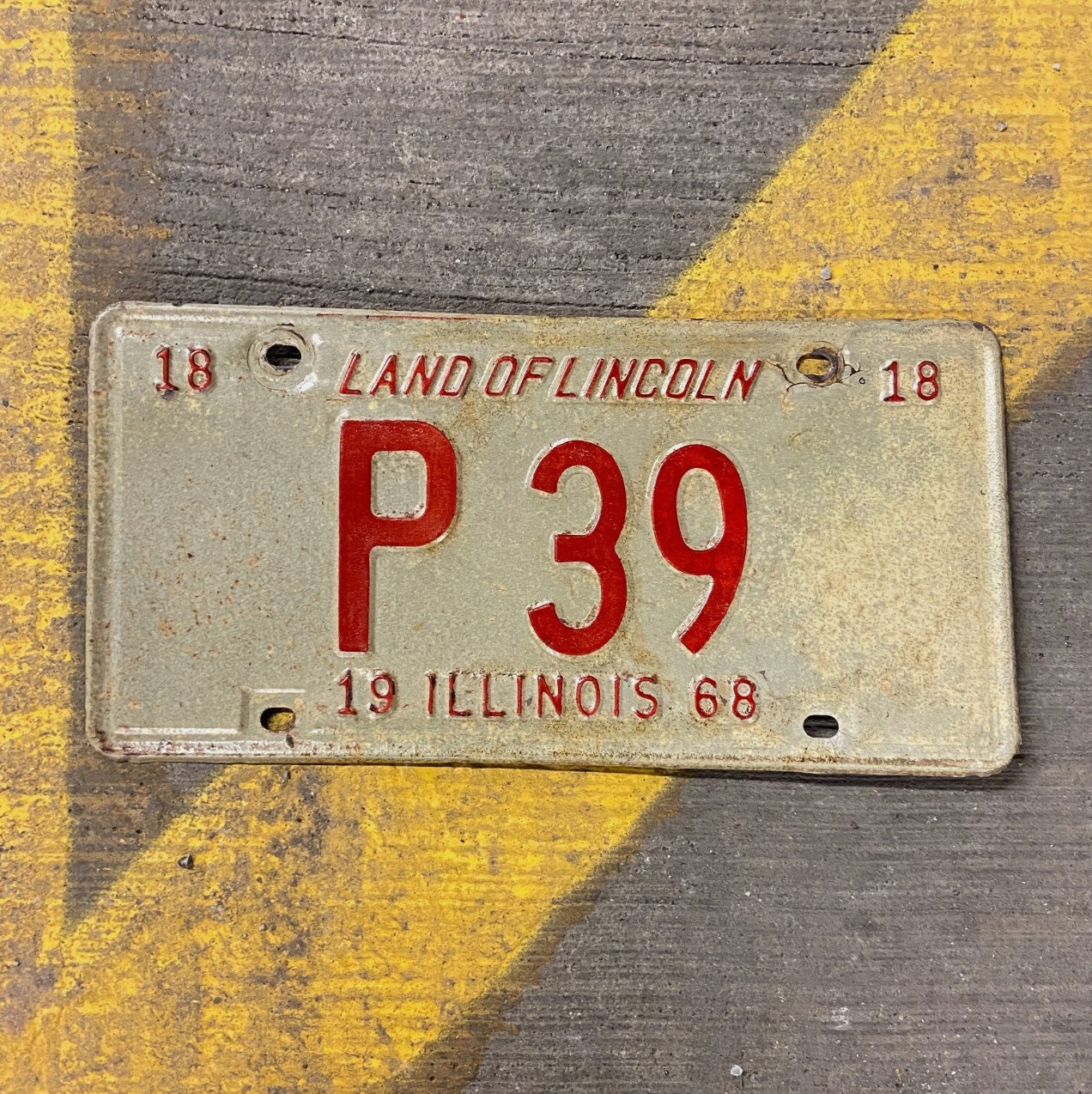 Photo of a 1968 Illinois Truck License Plate Auto Tag Garage Decor Vintage Low Number Two Digit P 39 with original patina