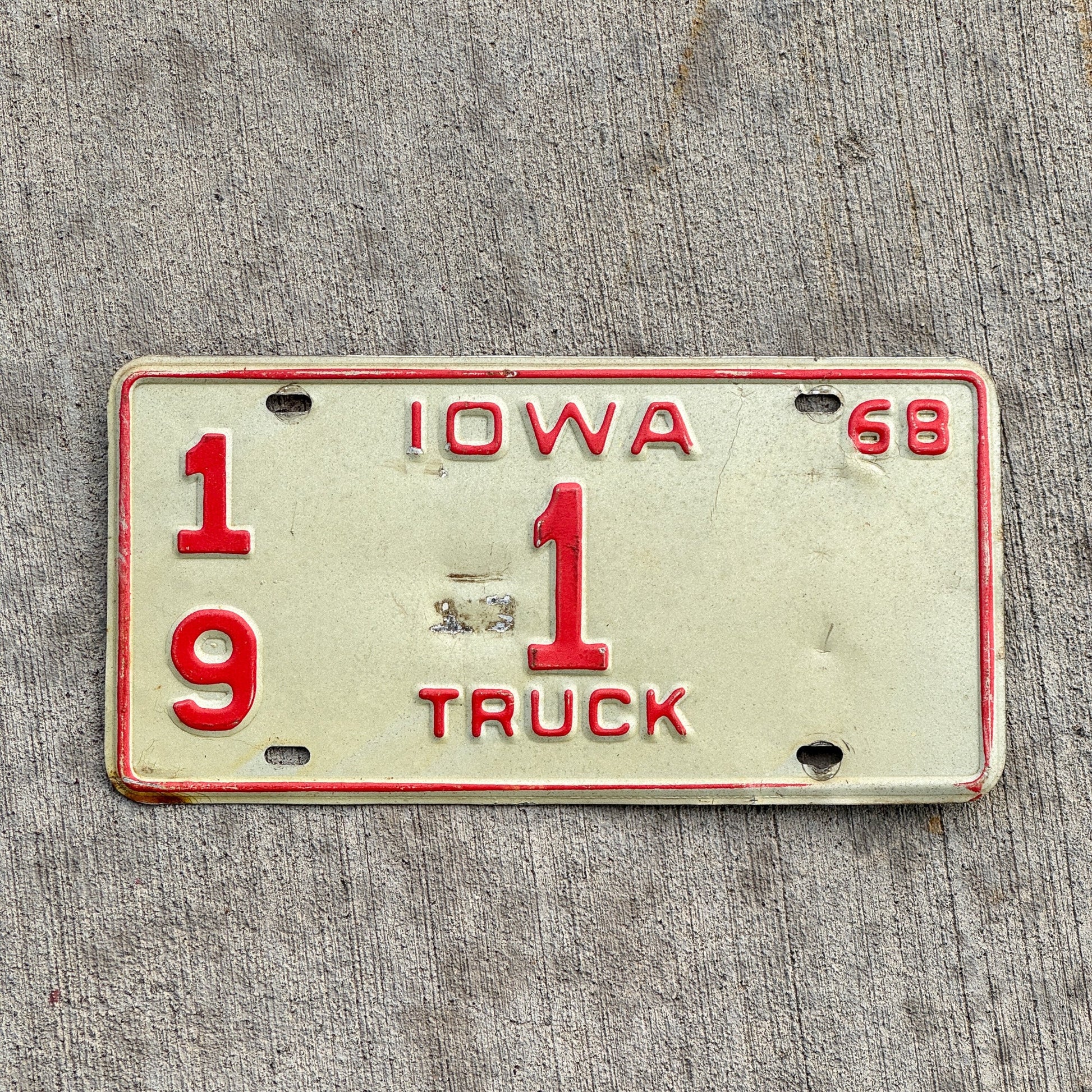 Photo of a 1968 Iowa Truck License Plate Auto Tag 1 Vintage Garage Low Number Single Digit Chickasaw County 19 1 with original patina