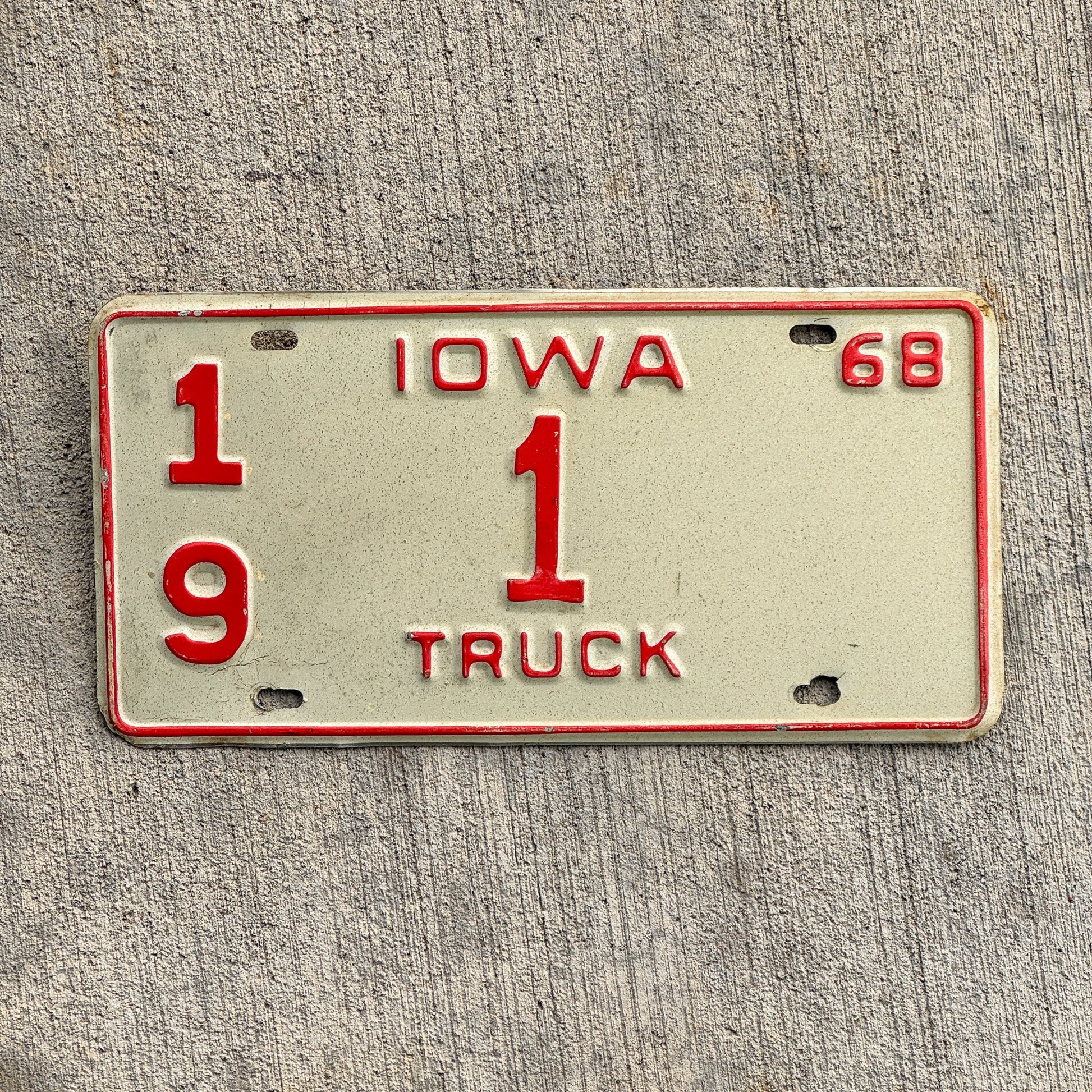 Photo of a 1968 Iowa Truck License Plate Auto Tag 2 Vintage Garage Low Number Single Digit Chickasaw County 19 1 with original patina