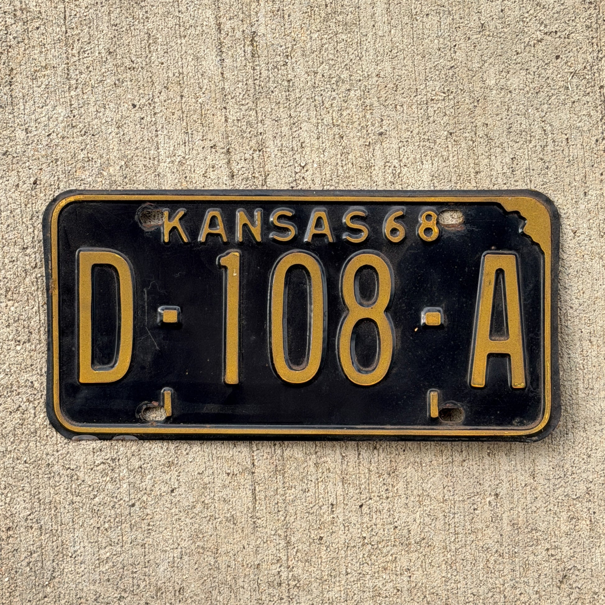 Photo of a 1968 Kansas Dealer License Plate Auto Tag Garage Decor Vintage D 108 A with original patina