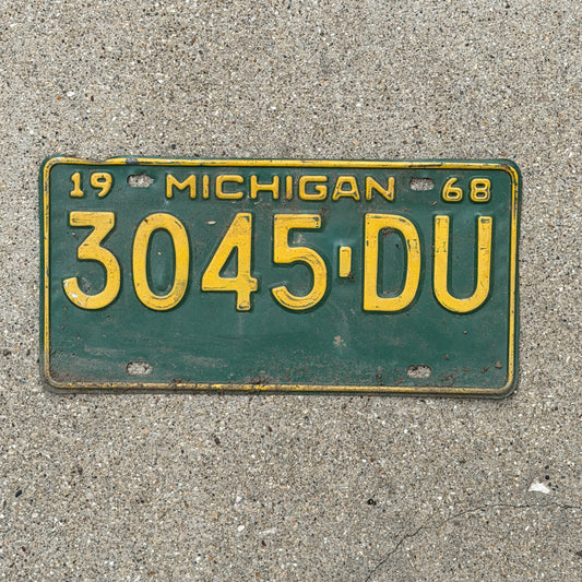 Photo of a 1968 Michigan Commercial License Plate Auto Tag Garage Decor Vintage 3045 DU with original patina