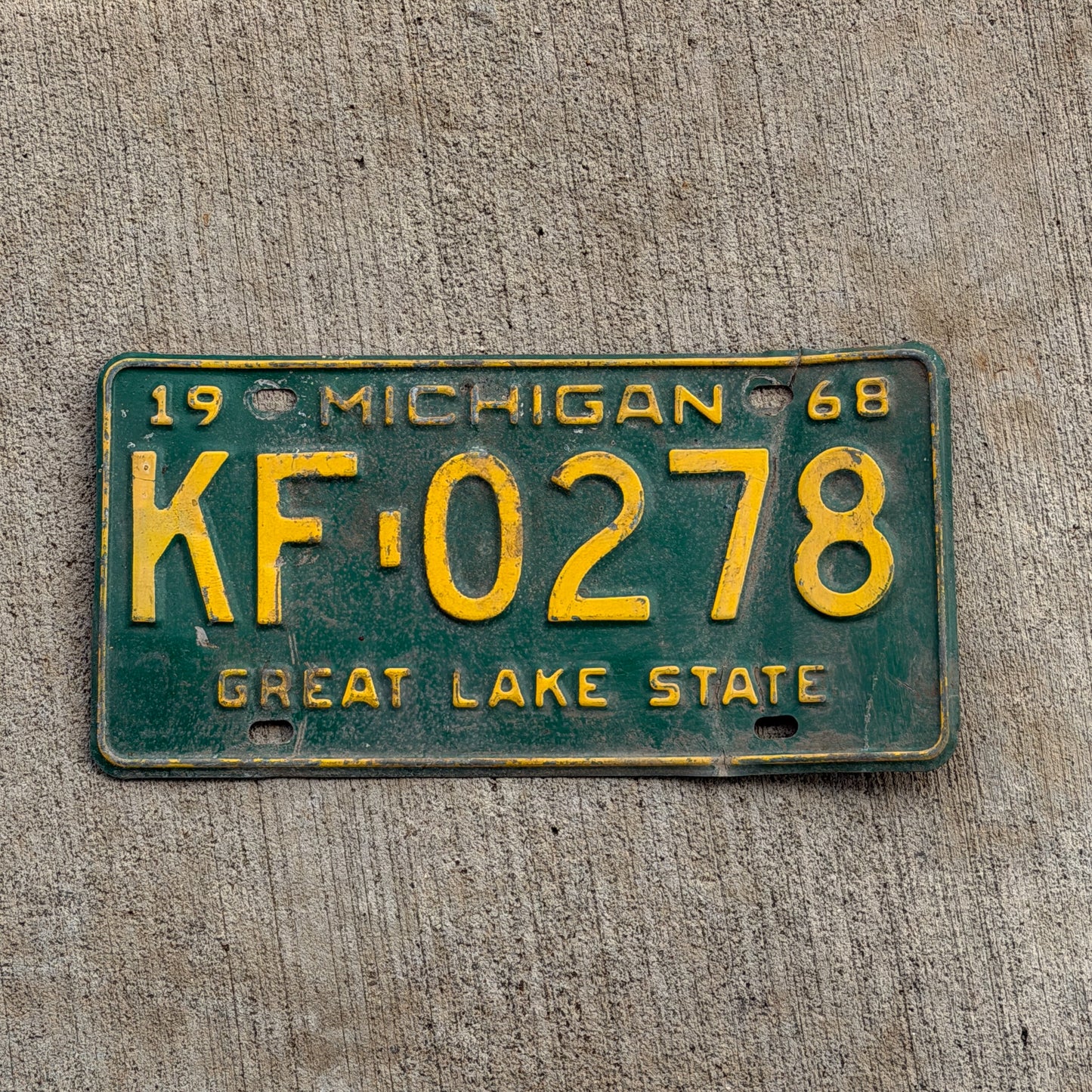 Photo of a 1968 Michigan License Plate Auto Tag 2 Vintage Garage KF 0278 with original patina