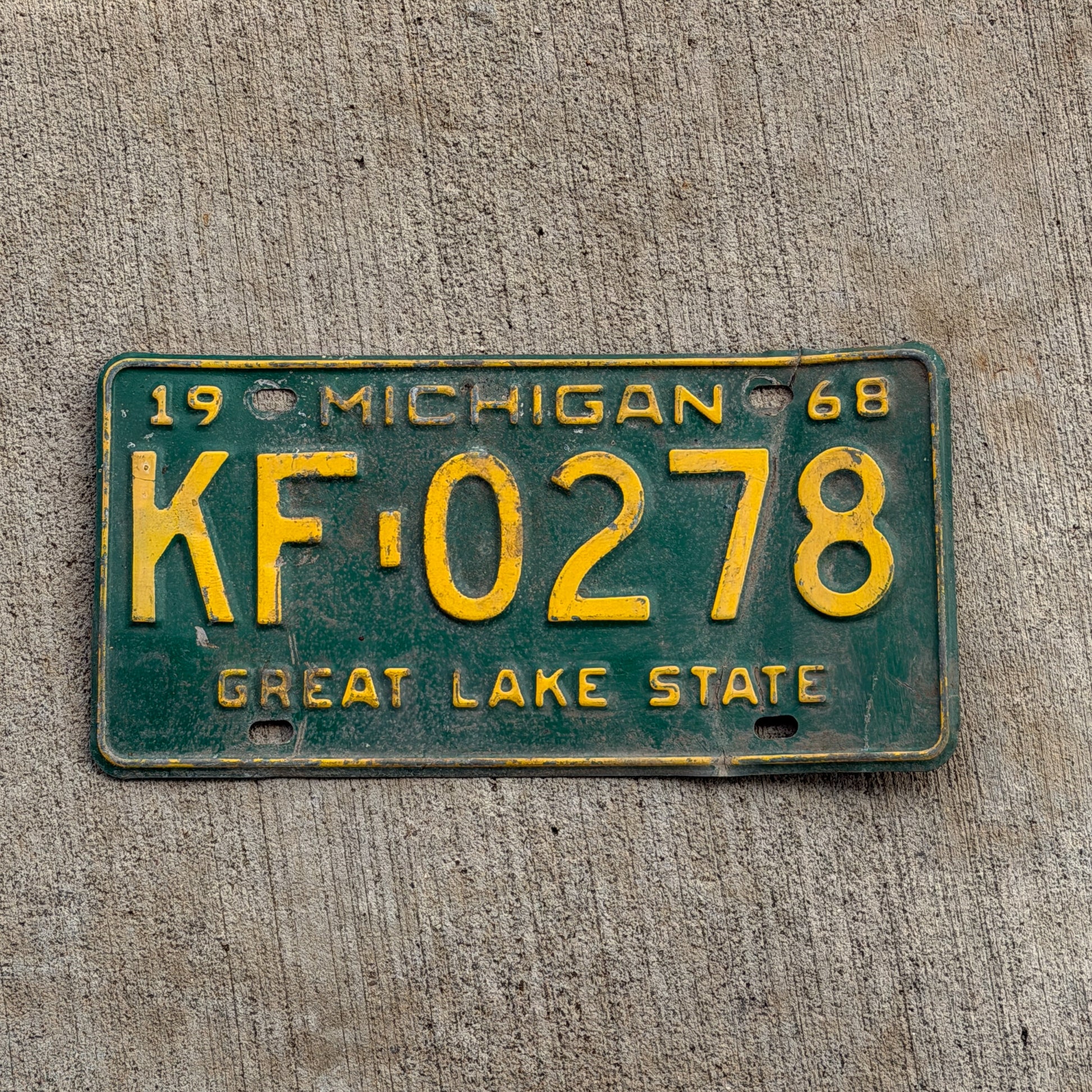 Photo of a 1968 Michigan License Plate Auto Tag 2 Vintage Garage KF 0278 with original patina