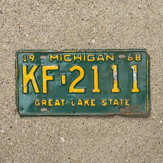 Photo of a 1968 Michigan License Plate Auto Tag Garage Decor Vintage Repeat Repeating KF 2111 with original patina