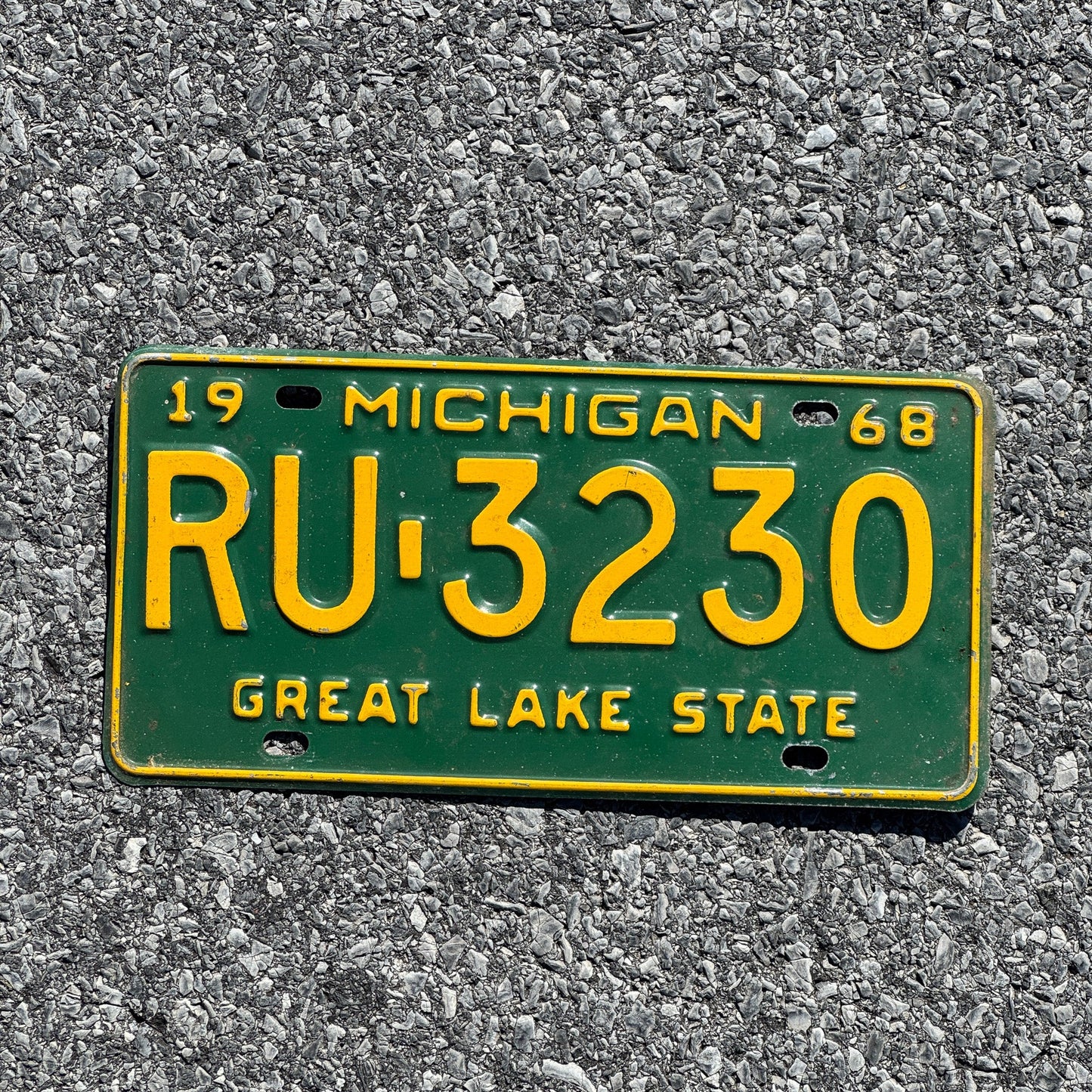 Photo of a 1968 Michigan License Plate Auto Tag Garage Decor Vintage RU 3230