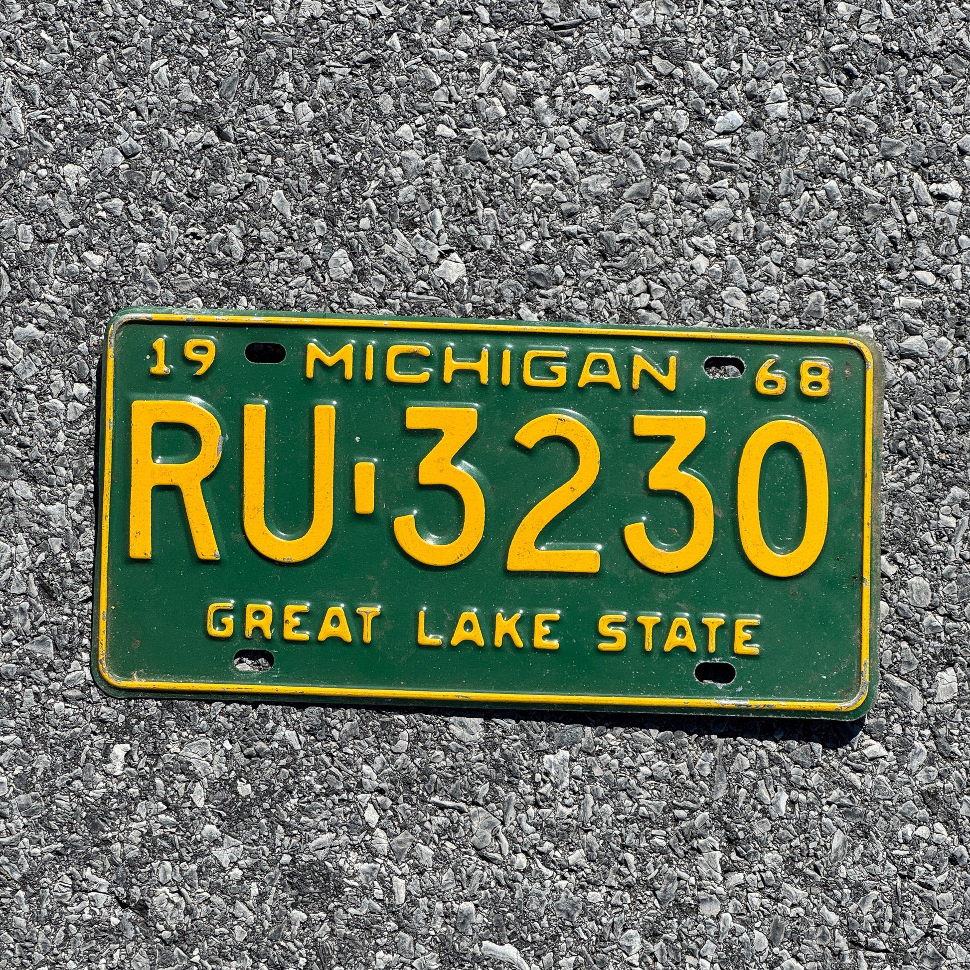 Photo of a 1968 Michigan License Plate Auto Tag Garage Decor Vintage RU 3230