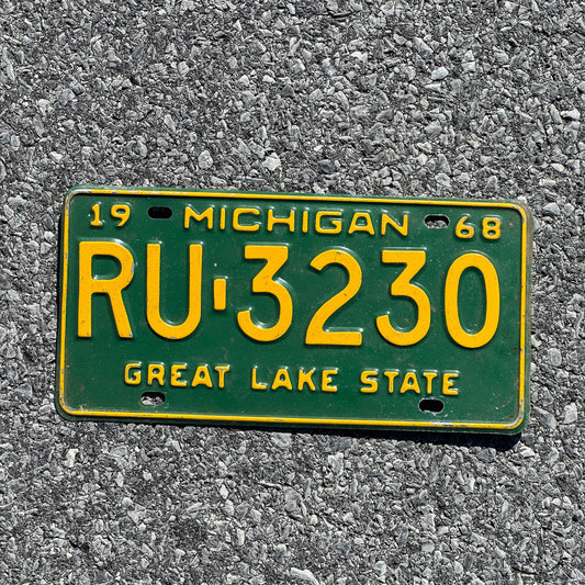 Photo of a 1968 Michigan License Plate Auto Tag Garage Decor Vintage RU 3230