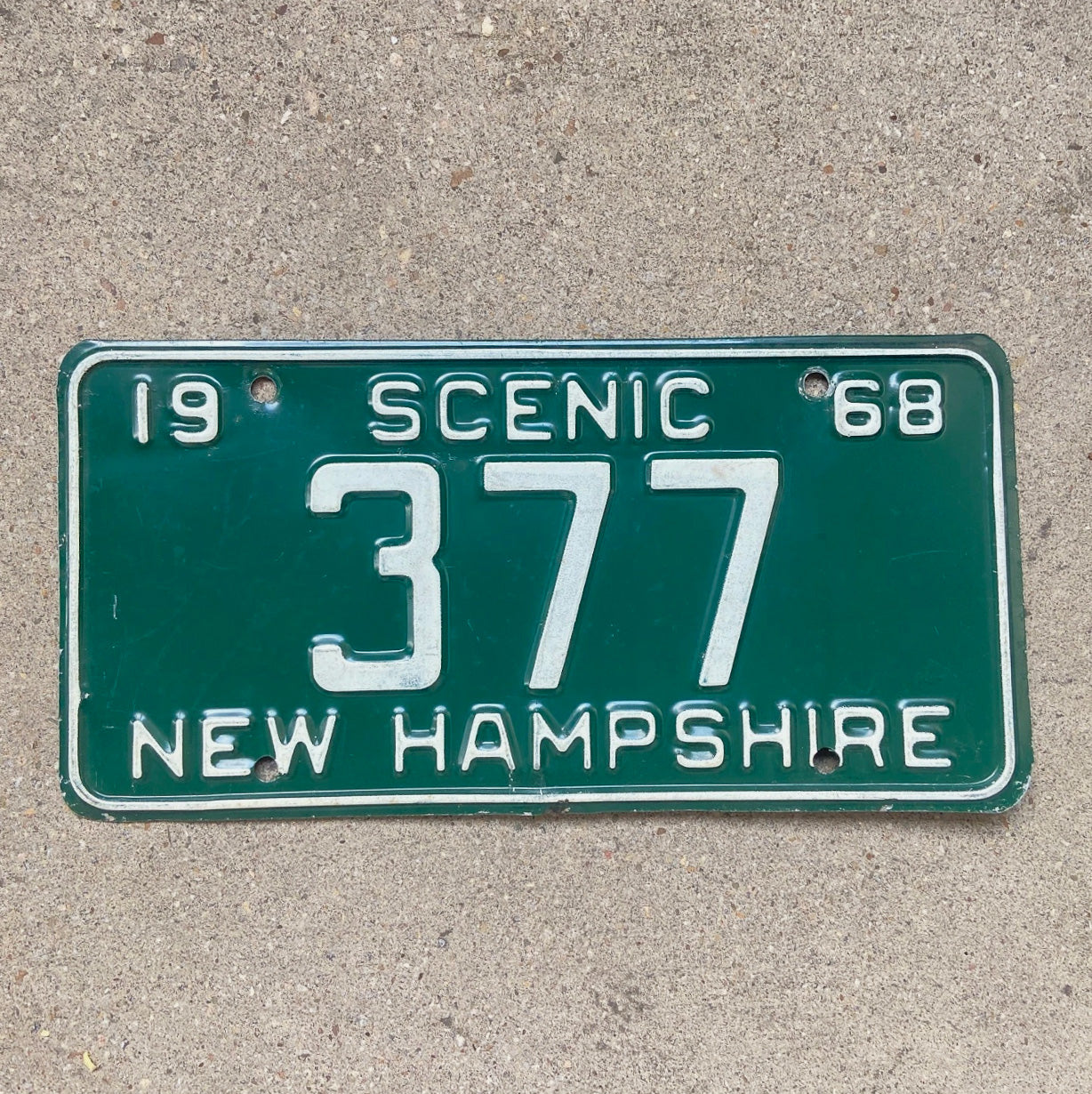 Photo of a 1968 New Hampshire License Plate Auto Tag Garage Decor Vintage Low Number Three Digit 377 with original patina