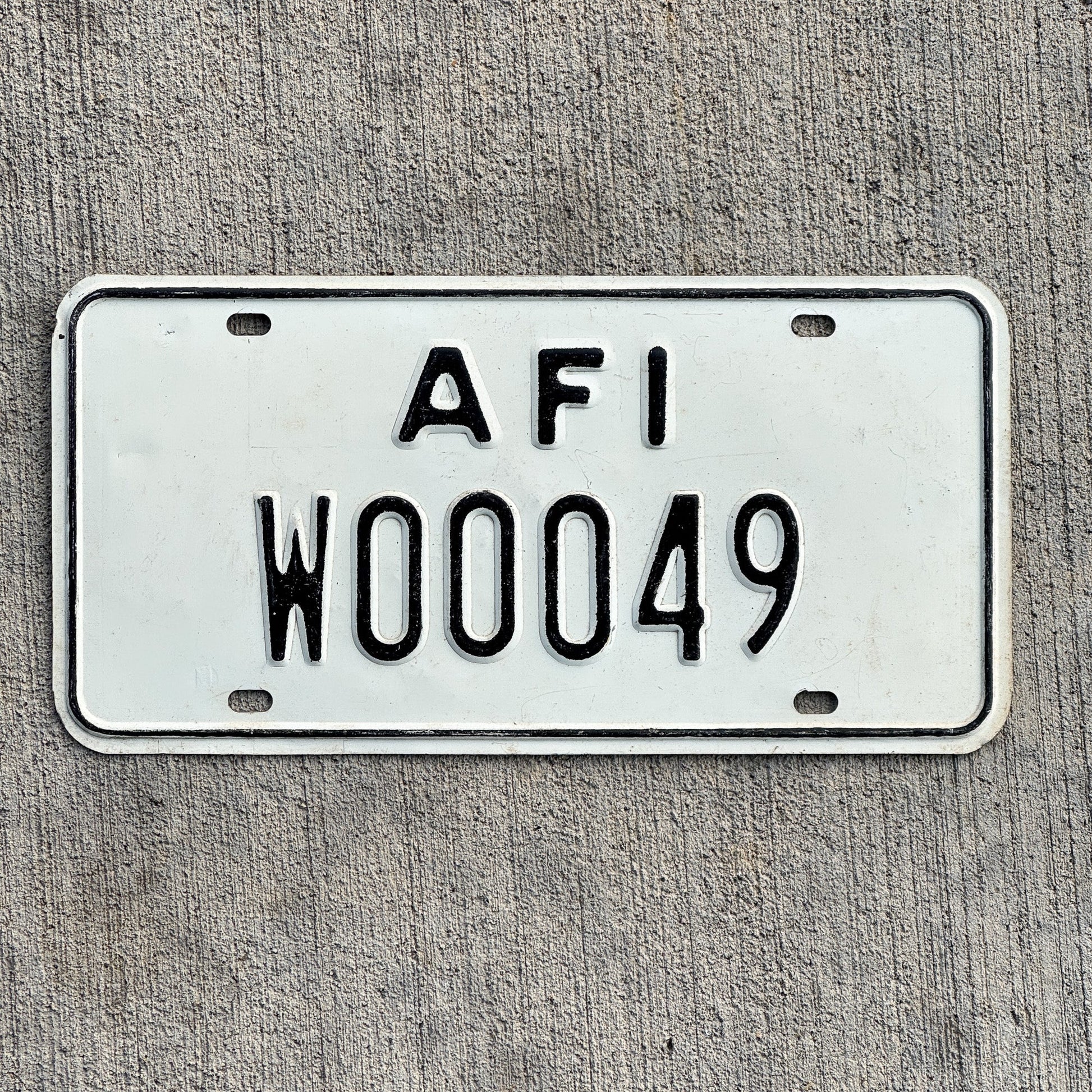 Photo of a 1968 US Forces Italy License Plate Auto Tag 1 Vintage Garage American Military 00049 with original patina