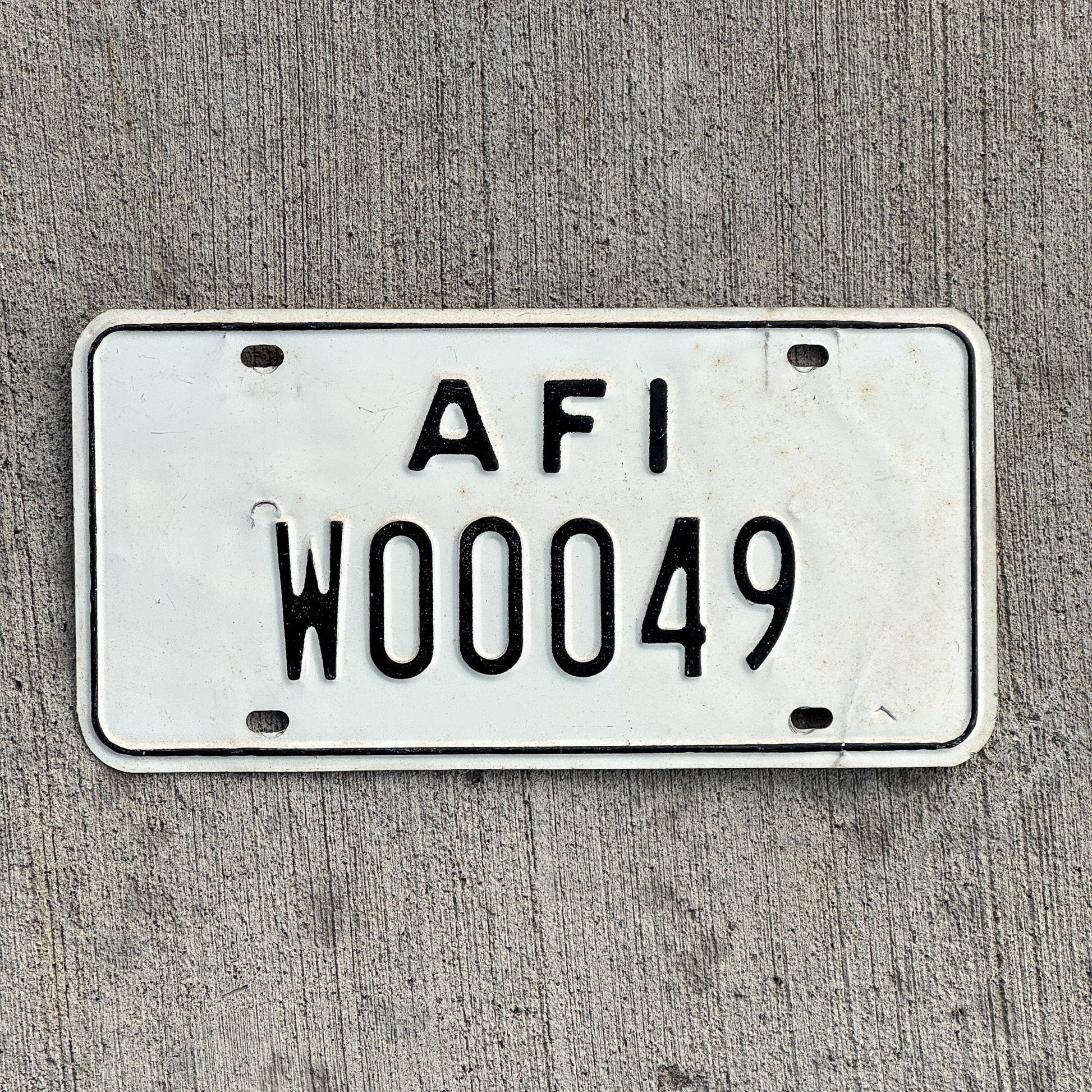 Photo of a 1968 US Forces Italy License Plate Auto Tag 2 Vintage Garage American Military 00049 with original patina