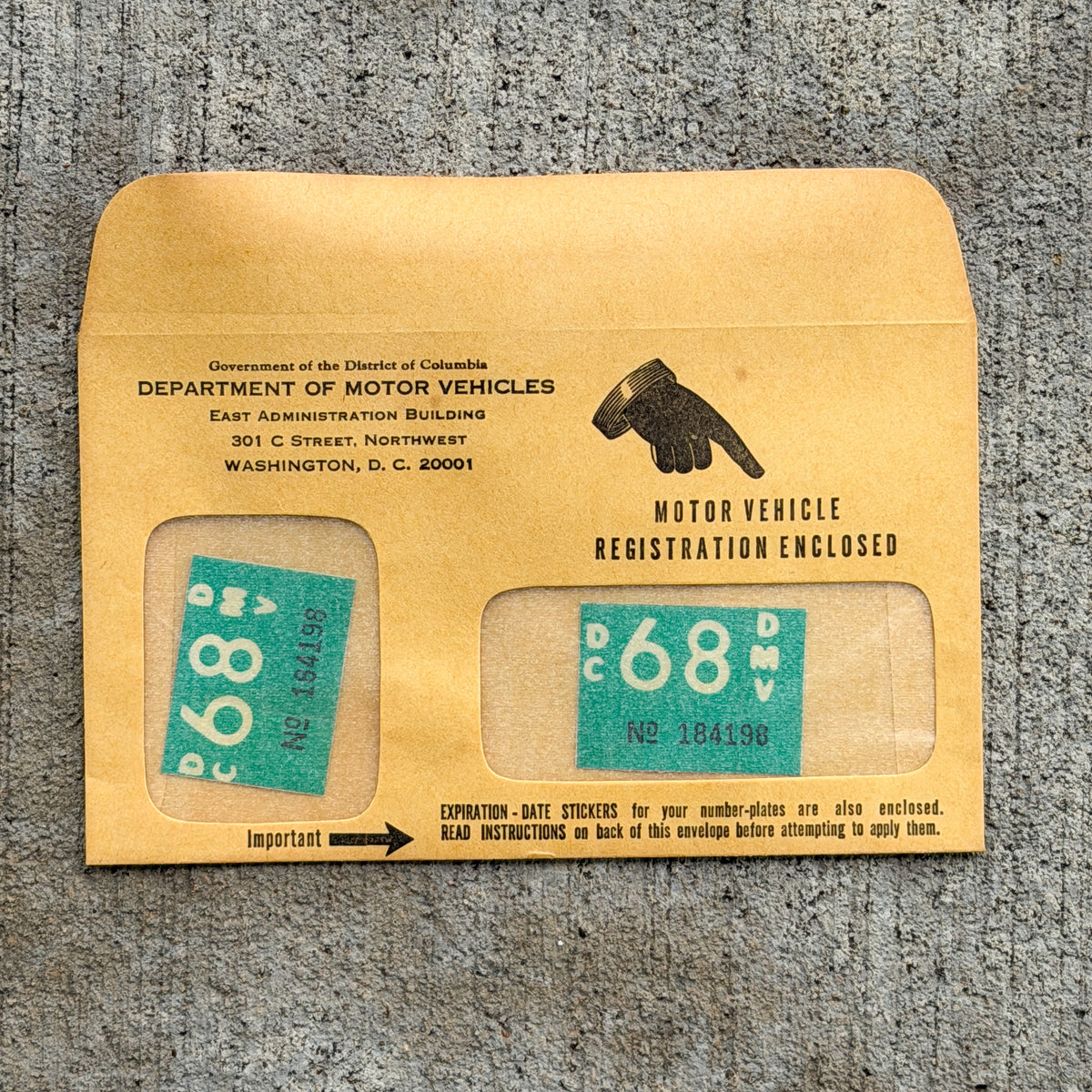 Photo of a 1968 Washington DC Sticker License Plate Pair Auto Tag Garage Decor Vintage NOS Registration Sticker With Envelope - RANDOM NUMBER with original patina