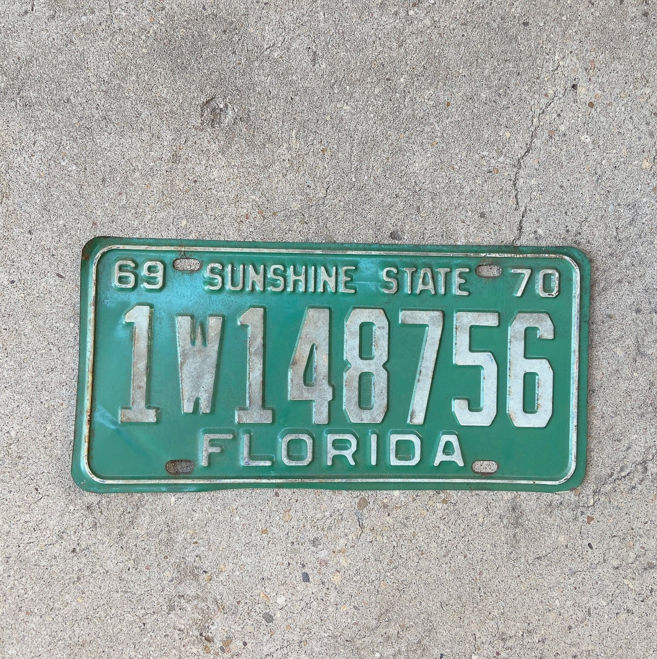 Photo of a 1969 1970 Florida License Plate Auto Tag Garage Decor Vintage 1 W 148756 with original patina