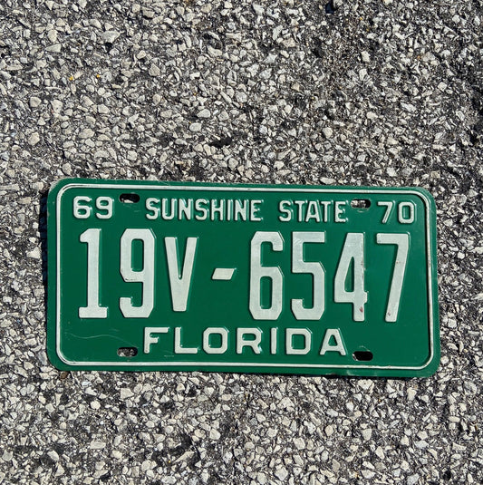 Photo of a 1969 1970 Florida Trailer License Plate Auto Tag Garage Decor Vintage Brevard County 19 V 6547 with original patina