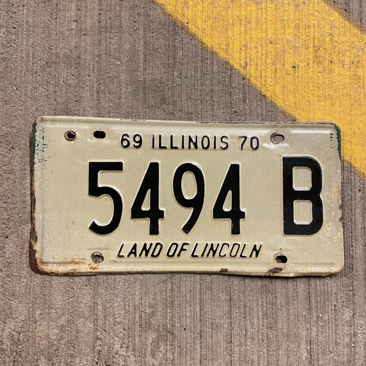 Photo of a 1969 1970 Illinois Truck License Plate Auto Tag 2 Vintage Garage 5494 B with original patina