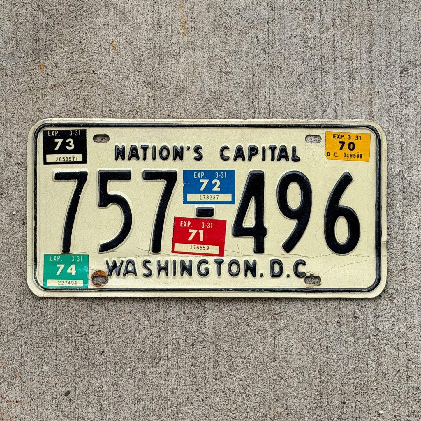 Photo of a 1969 1974 Washington DC License Plate Auto Tag Garage Decor Vintage 757 496 with original patina
