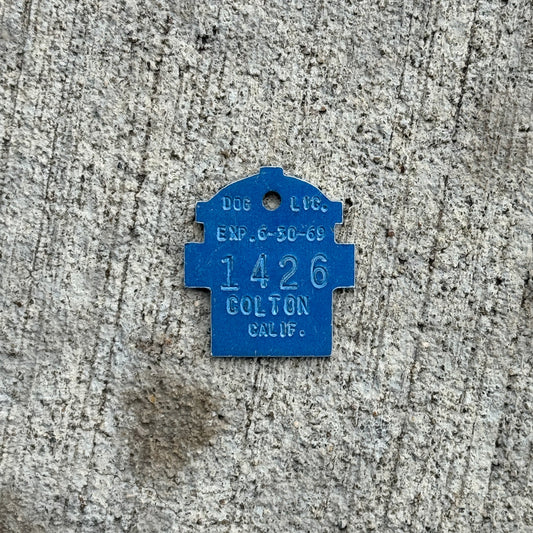 Photo of a 1969 California Dog License Auto Tag Garage Decor Vintage Colton 1426 with original patina