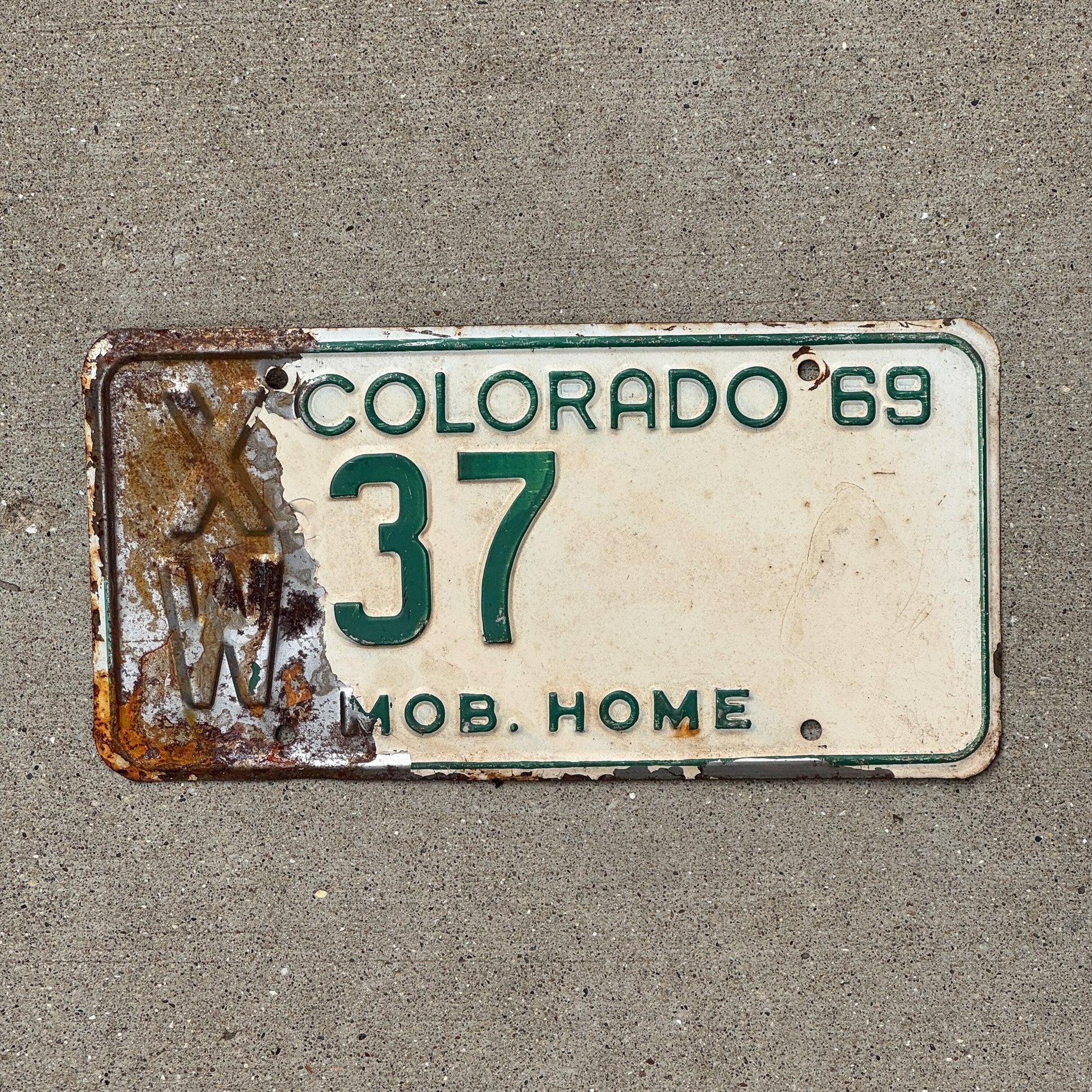 Photo of a 1969 Colorado Mobile Home License Plate Auto Tag Garage Decor Vintage XW 37