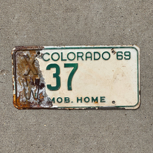 Photo of a 1969 Colorado Mobile Home License Plate Auto Tag Garage Decor Vintage XW 37