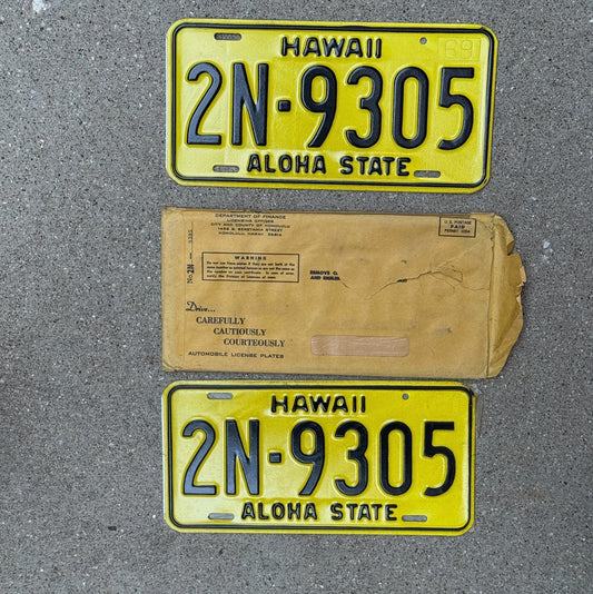 Photo of a 1969 Hawaii License Plate Pair Auto Tag Garage Decor Vintage New Old Stock High Quality With Envelope Honolulu County 2N 9305 with original patina