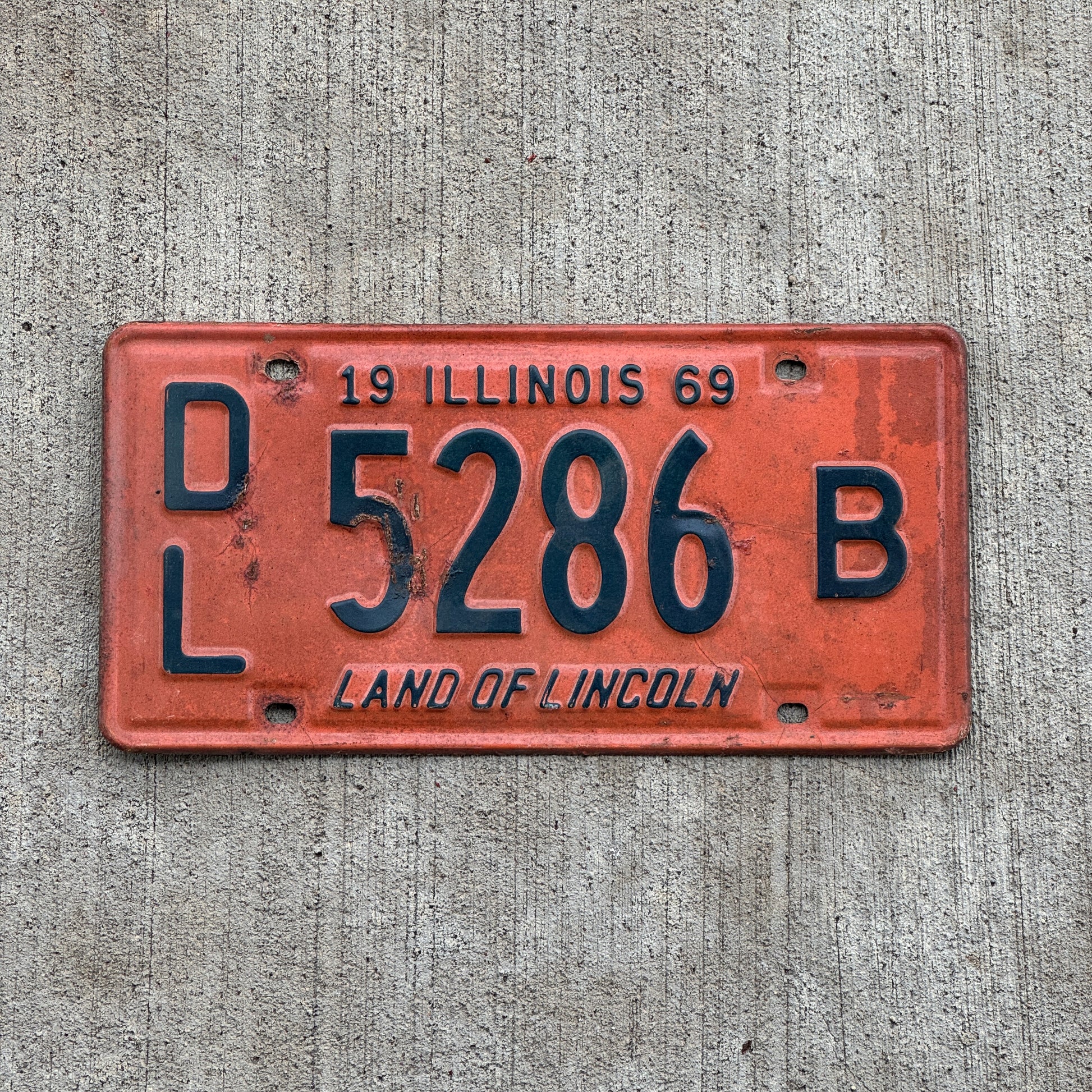 Photo of a 1969 Illinois Dealer License Plate Auto Tag Garage Decor Vintage 5286 B with original patina