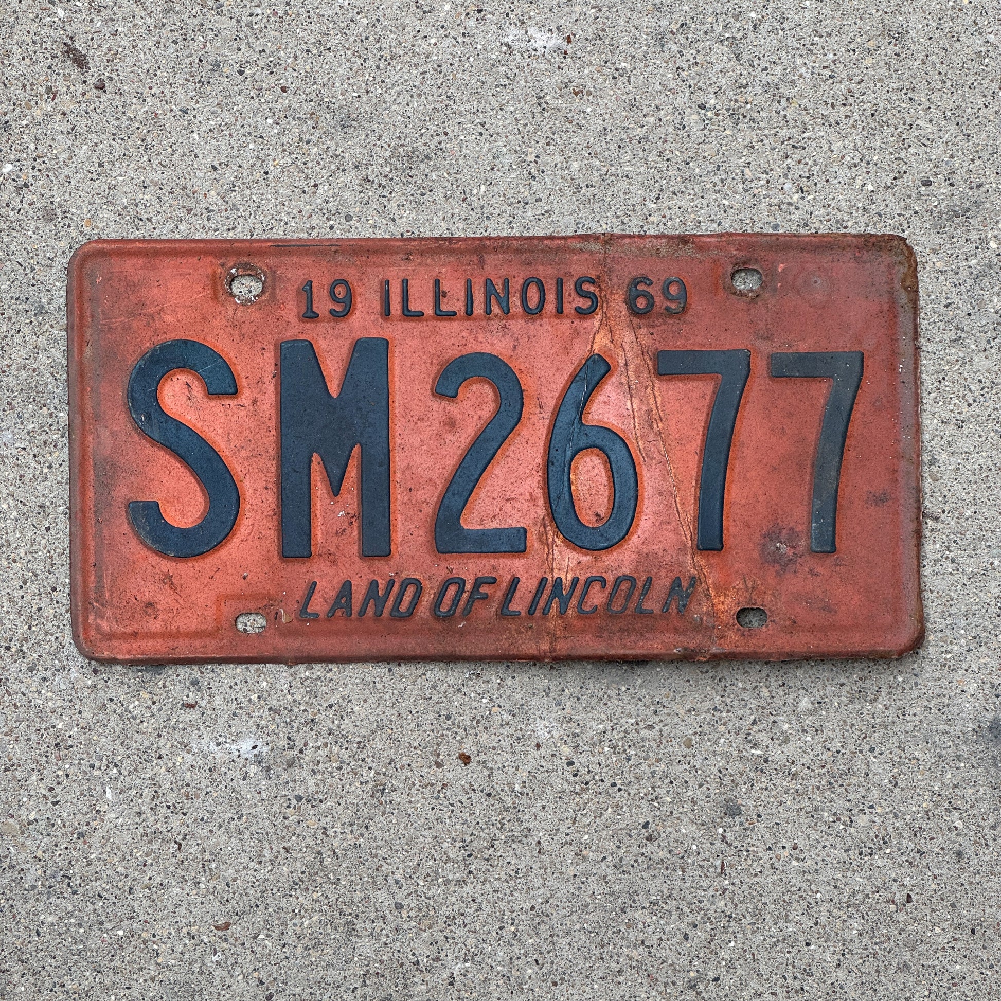 Photo of a 1969 Illinois License Plate Auto Tag 1 Vintage Garage SM 2677 with original patina