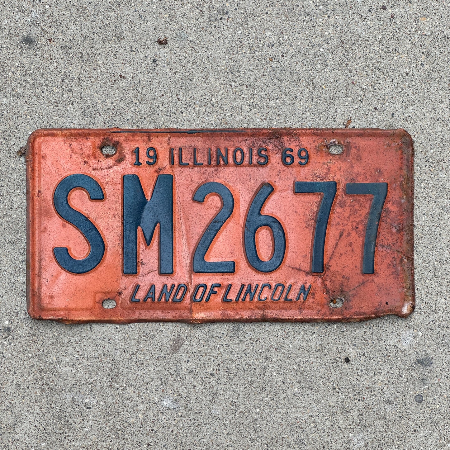 Photo of a 1969 Illinois License Plate Auto Tag 2 Vintage Garage SM 2677 with original patina