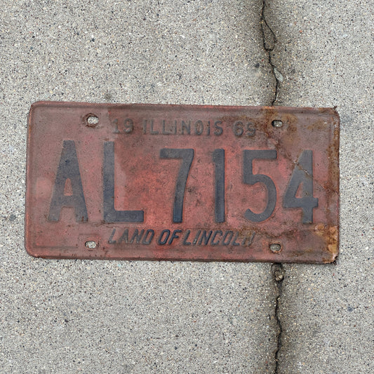Photo of a 1969 Illinois License Plate Auto Tag Garage Decor Vintage AL 7154 with original patina