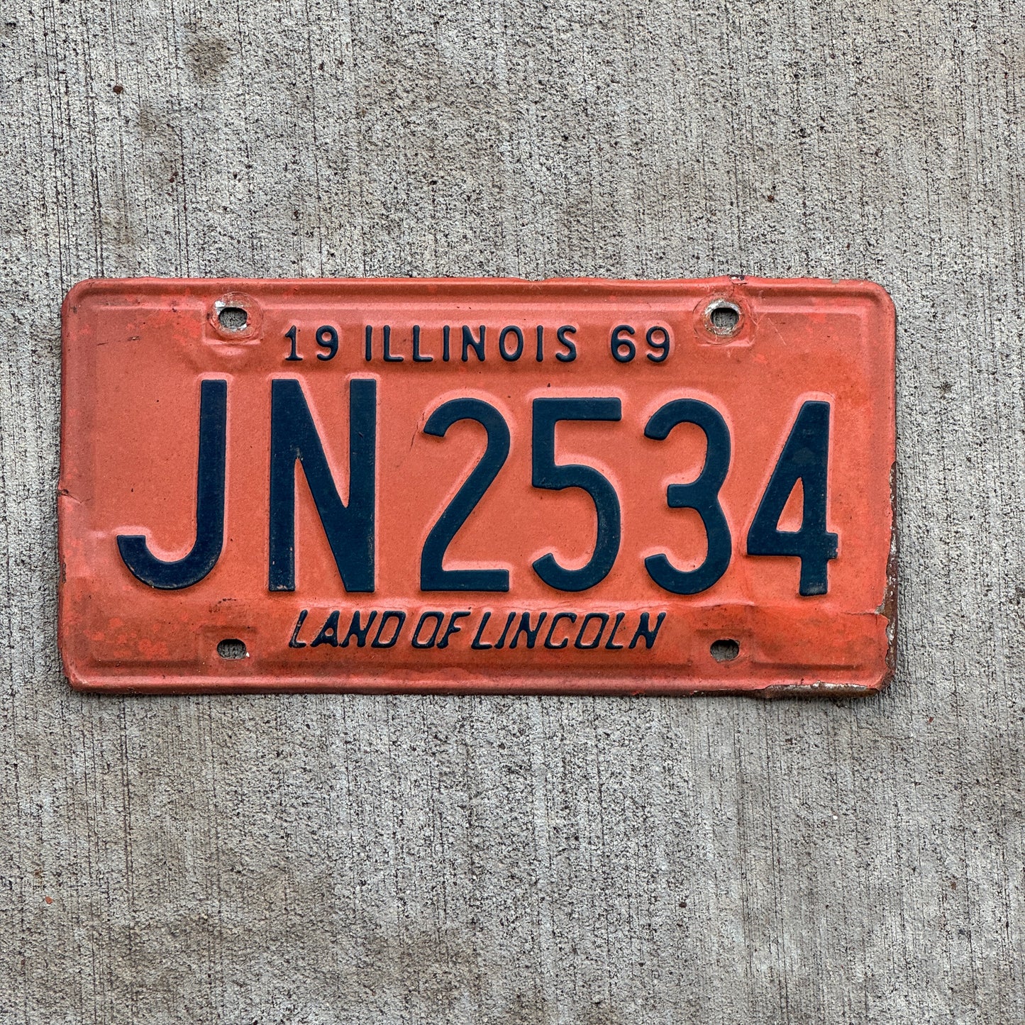 Photo of a 1969 Illinois License Plate Auto Tag Garage Decor Vintage JN 2534 with original patina