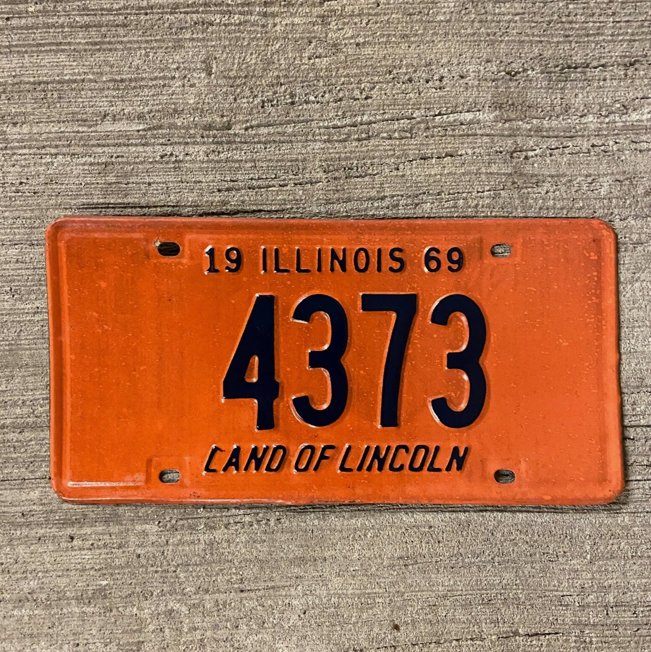 Photo of a 1969 Illinois License Plate Auto Tag Garage Decor Vintage Low Number Four Digit 4373 with original patina