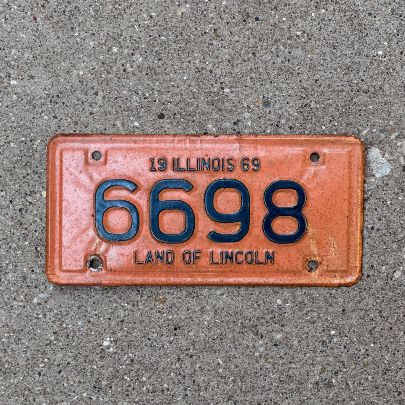 Photo of a 1969 Illinois Motorcycle License Plate Auto Tag Garage Decor Vintage 6698 with original patina