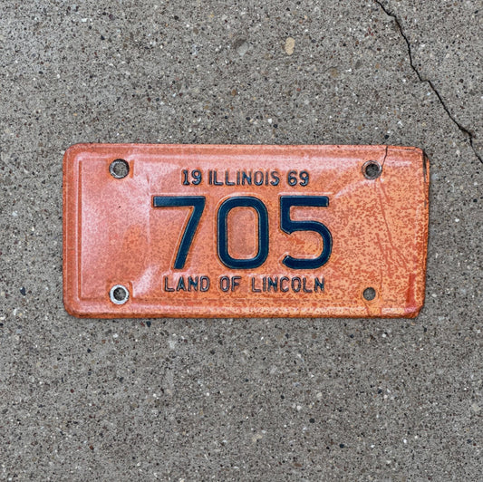Photo of a 1969 Illinois Motorcycle License Plate Auto Tag Garage Decor Vintage Low Number Three Digit 705 with original patina