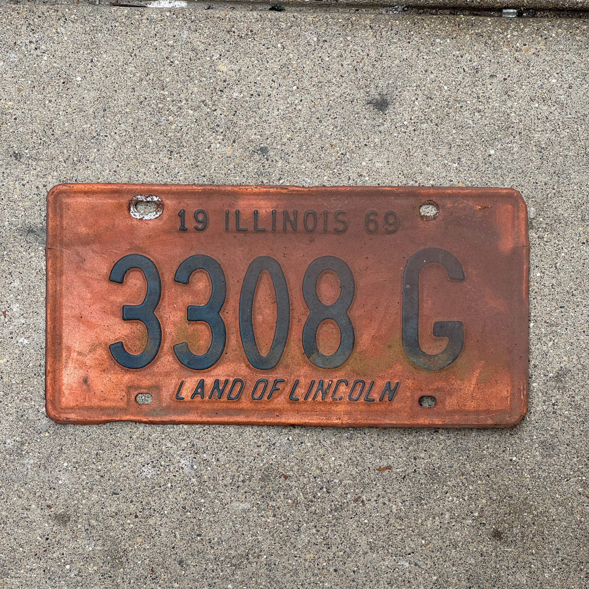 Photo of a 1969 Illinois Truck License Plate Auto Tag Garage Decor Vintage 3308 G with original patina