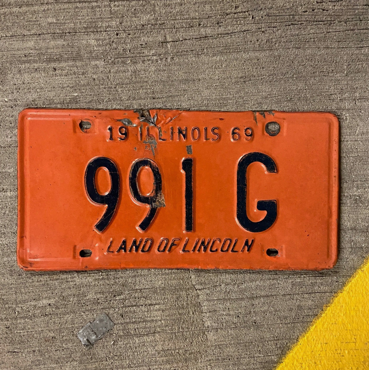 Photo of a 1969 Illinois Truck License Plate Auto Tag Garage Decor Vintage 991 G with original patina