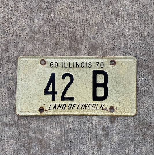 Photo of a 1969 Illinois Truck License Plate Auto Tag Garage Decor Vintage Low Number Two Digit 42 B with original patina