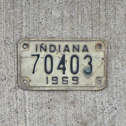Photo of a 1969 Indiana Motorcycle License Plate Auto Tag Garage Decor Vintage 70403 with original patina