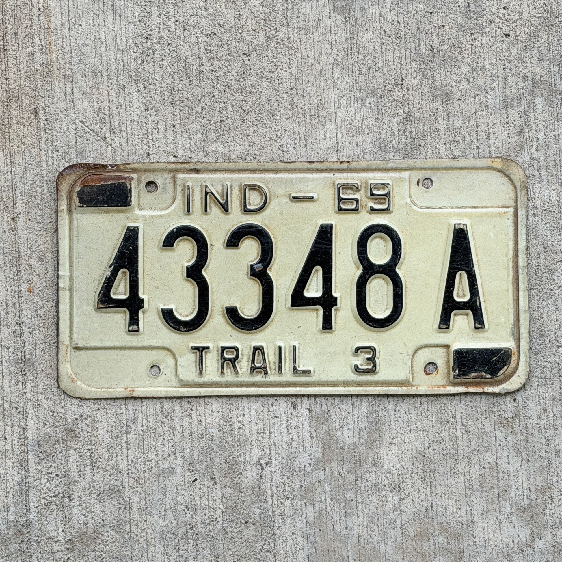 Photo of a 1969 Indiana Trailer License Plate Auto Tag Garage Decor Vintage 43348 A with original patina