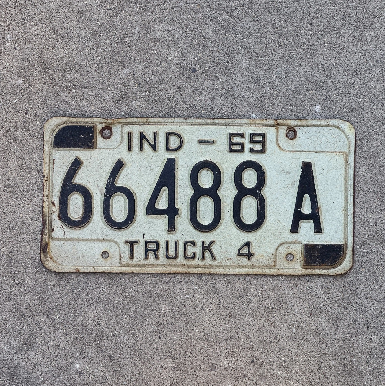 Photo of a 1969 Indiana Truck License Plate Auto Tag Garage Decor 66488 A