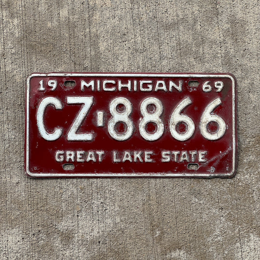 Photo of a 1969 Michigan License Plate Auto Tag Garage Decor Vintage CZ 8866 with original patina