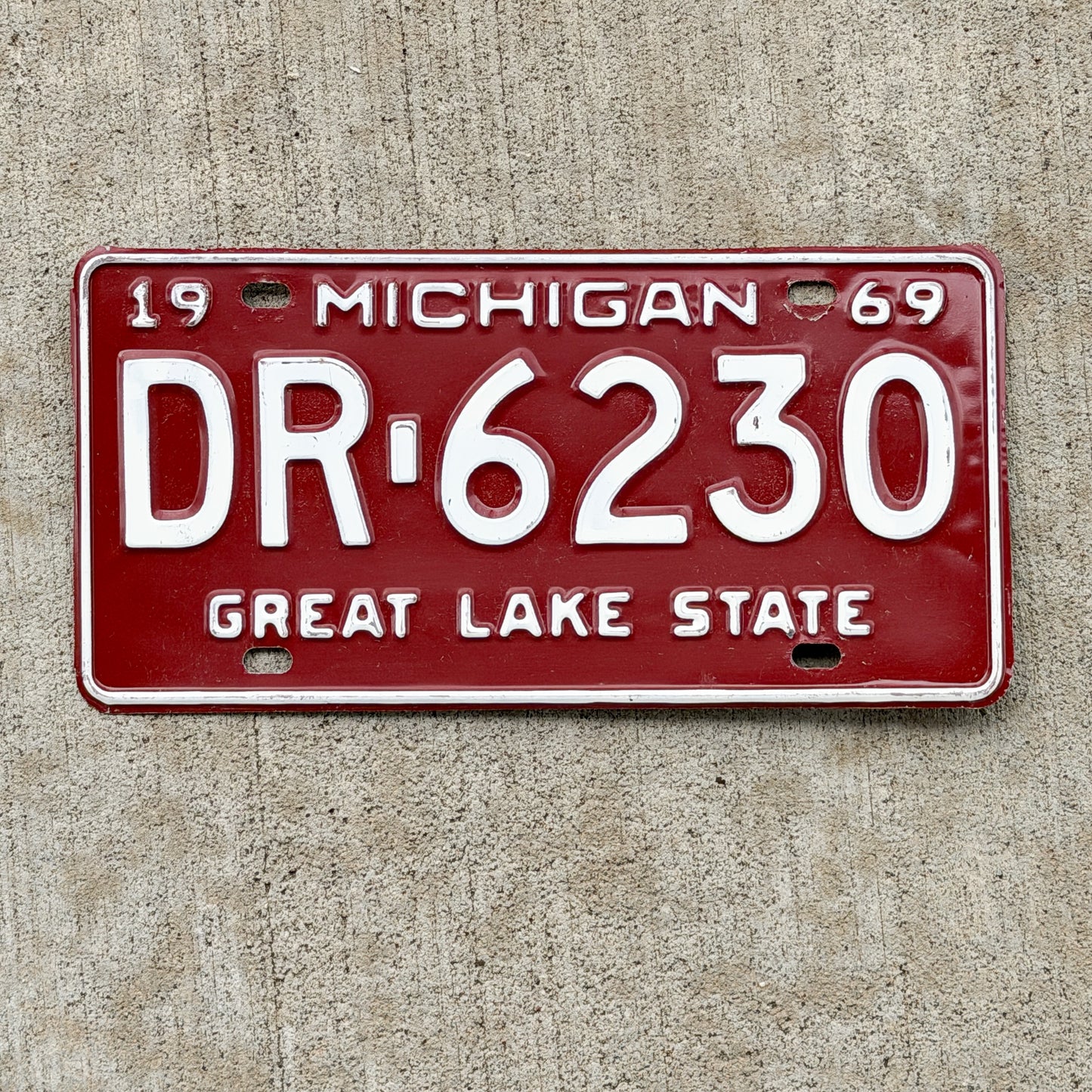 Photo of a 1969 Michigan License Plate Auto Tag Garage Decor Vintage DR 6230 with original patina
