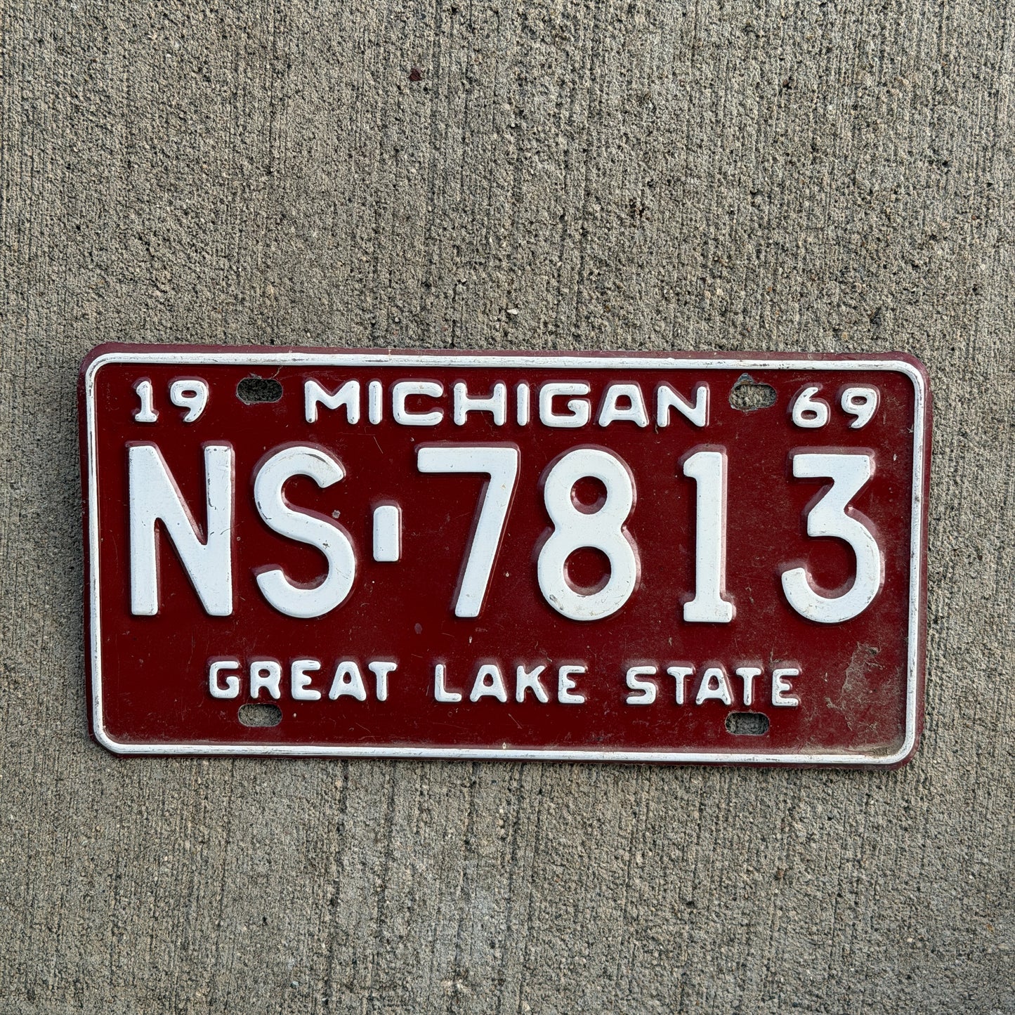 Photo of a 1969 Michigan License Plate Auto Tag Garage Decor Vintage NS 7813 with original patina